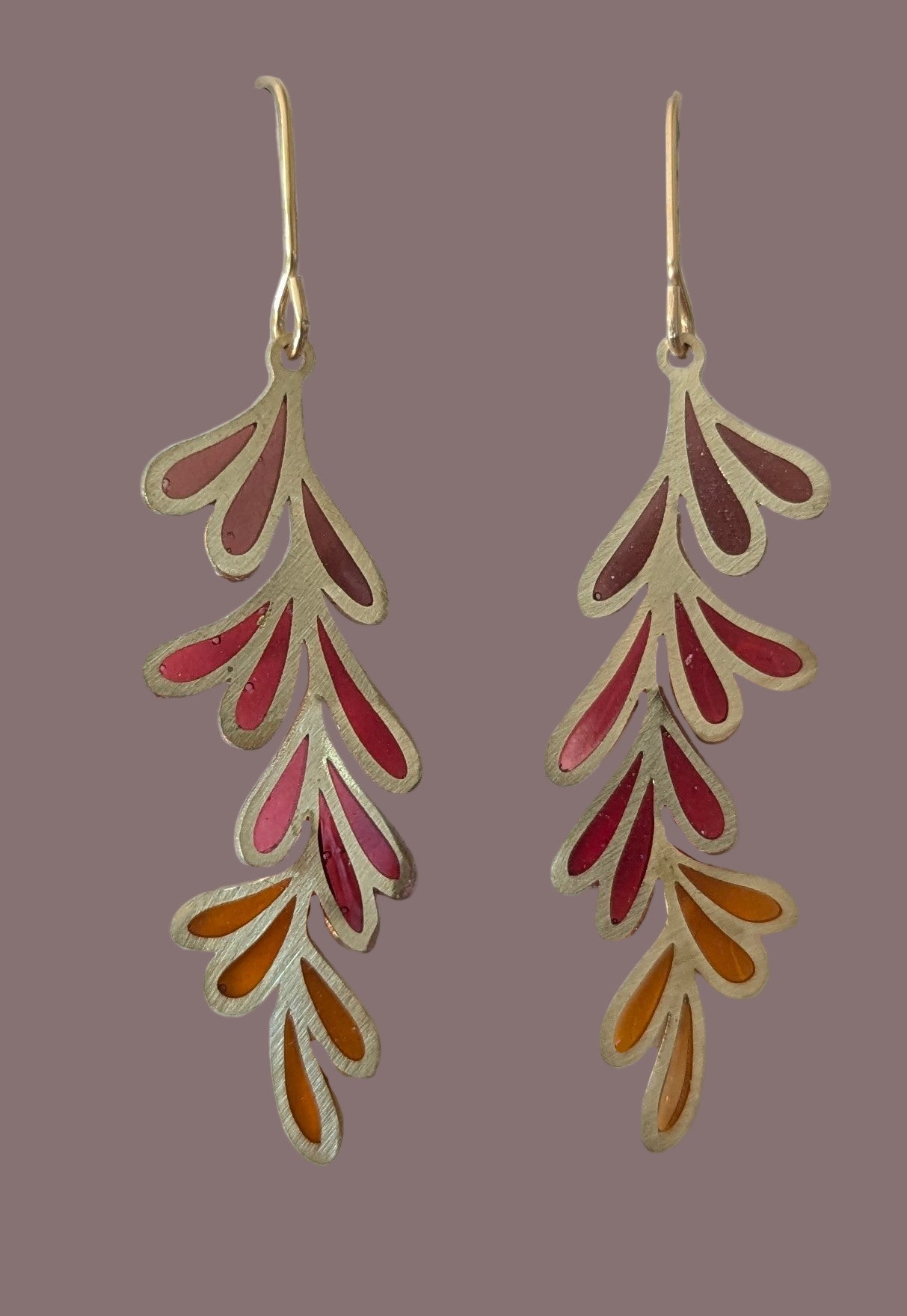 Gold and red leaf-shaped earrings on a white card with 'Muro Jewelry' branding.